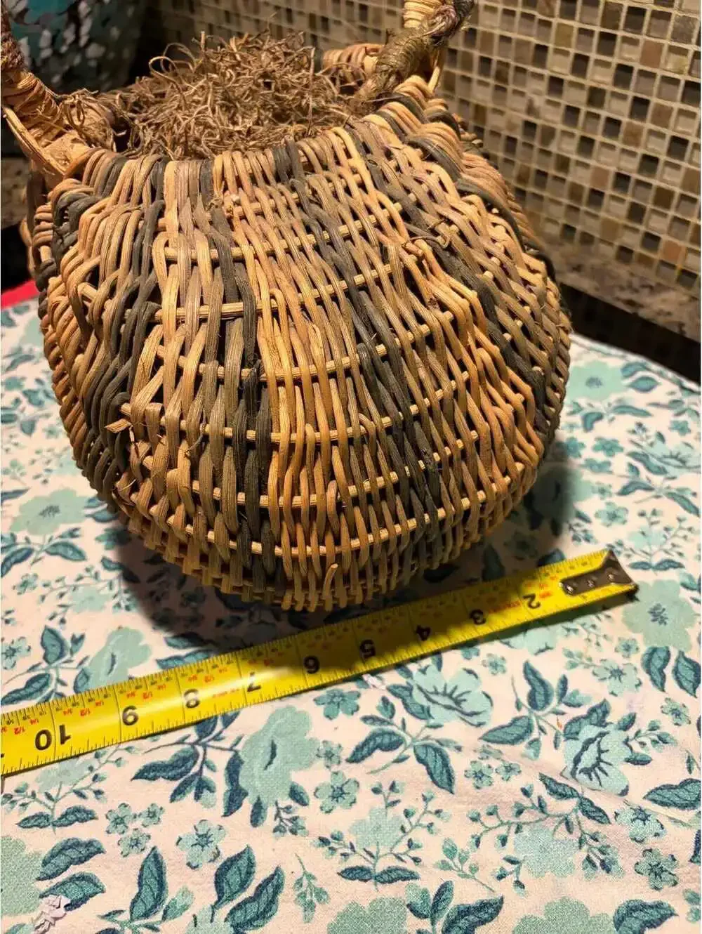 This is a vintage hand-woven double buttocks wicker harvest basket.